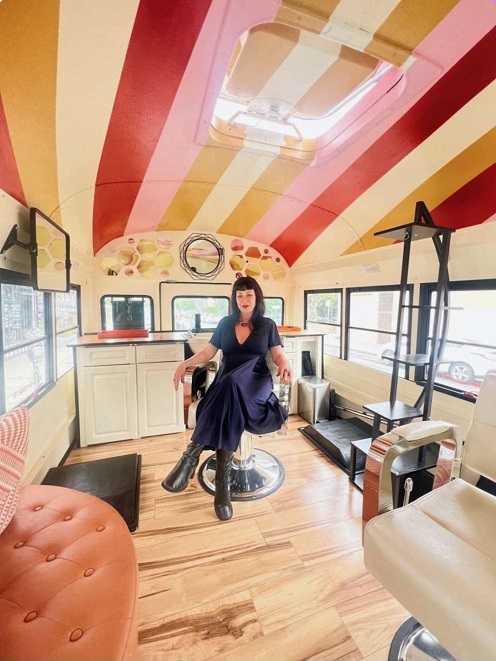 VaVoom Hair-a-Van parked on street in Silverlake with the stylist Dawn Klein on the Interior of the Hair-a-Van